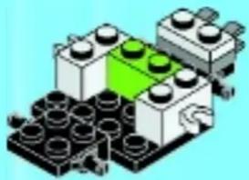 Isometric illustration of a LEGO base with green and black components (no text or symbols)