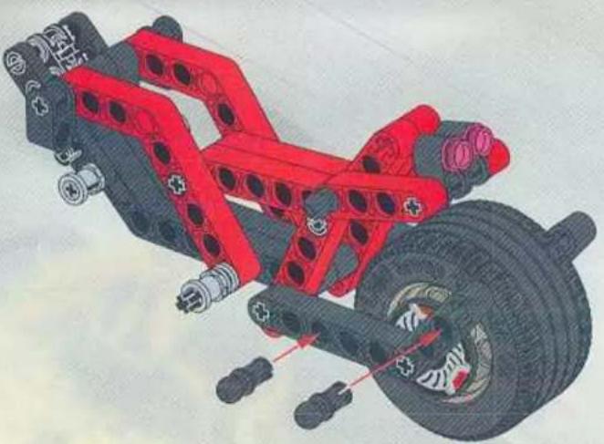 Illustration of a vehicle's suspension system with red and black components, showing tire, brake, and wheel assembly (no text or labels)