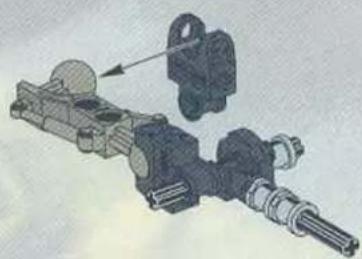 Mechanical assembly diagram showing a shaft and housing assembly with an arrow indicating direction (no text or labels)