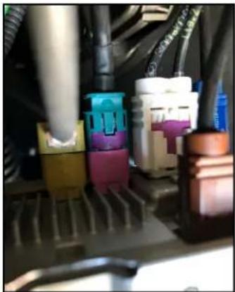 Close-up of various electronic components with colored connectors (no visible text or symbols)