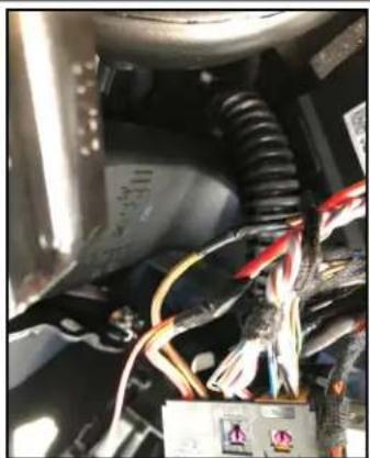 Close-up of electrical wiring and components in a mechanical assembly (no visible text or symbols)