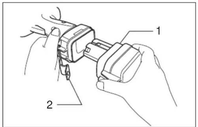 Technical diagram showing hands installing a belt buckle assembly with labeled parts 1 and 2