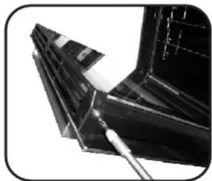 Close-up of a mechanical component with a tool applying material (no visible text or symbols)