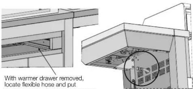 With warmer drawer removed, locate flexible hose and put
