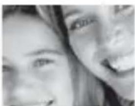 Close-up of two people smiling, no visible text or symbols