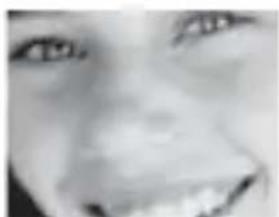 Close-up grayscale photo of a person's face (no visible text or symbols)