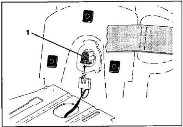 Technical diagram showing a device with labeled components and an arrow pointing to a component, likely illustrating a mechanical or electrical assembly.