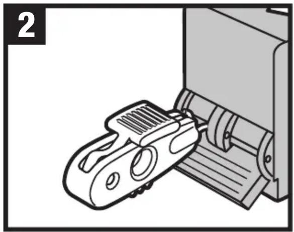 Ilustracja urządzenia mechanicznego wkładanego do maszyny (bez widocznego tekstu i symboli)