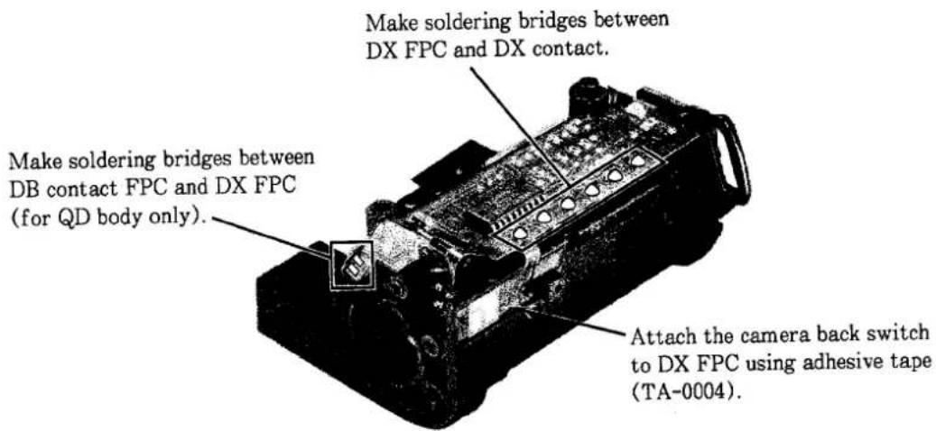 Make soldering bridges between DX FPC and DX contact. Make soldering bridges between DB contact FPC and DX FPC (for QD body only). Attach the camera back switch to DX FPC using adhesive tape (TA-0004).