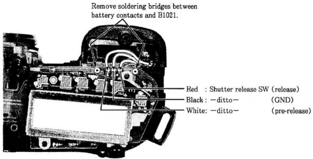 Remove soldering bridges between battery contacts and B1021. Red : Shutter release SW (release) Black : -ditto- (GND) White: -ditto- (pre-release)