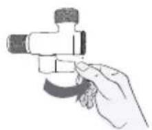 Hand holding a mechanical valve or fitting with a circular base (no text or symbols visible)