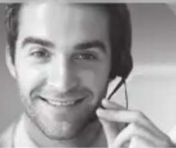 Close-up portrait of a smiling man with hand near ear (no visible text or symbols)