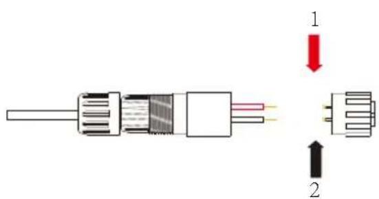 Diagram of a cable connector with labeled parts and directional arrows indicating assembly or movement.