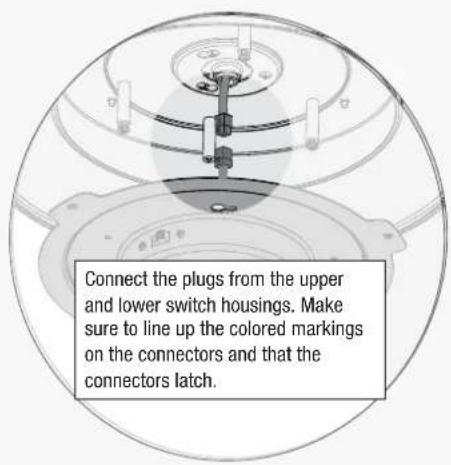 Connect the plugs from the upper and lower switch housings. Make sure to line up the colored markings on the connectors and that the connectors latch.