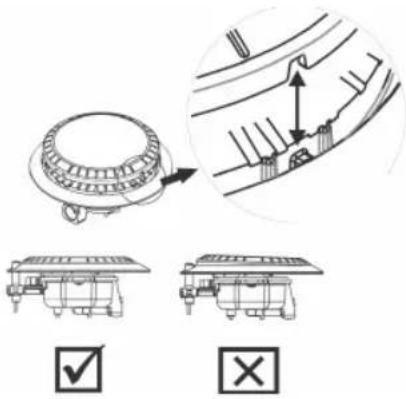 Technical diagram showing mechanical assembly with check and cross icons, including a magnified detail view of a component.