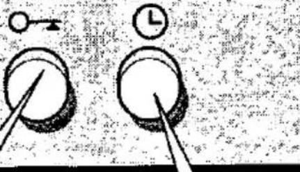Diagram showing two circular objects with arrows indicating direction, one with a pointer and the other with a clock.