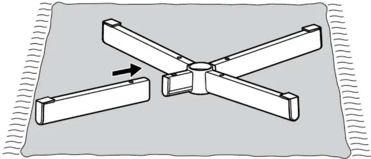 Diagram of a four-petal fan assembly with an arrow indicating rotation, no text or symbols present