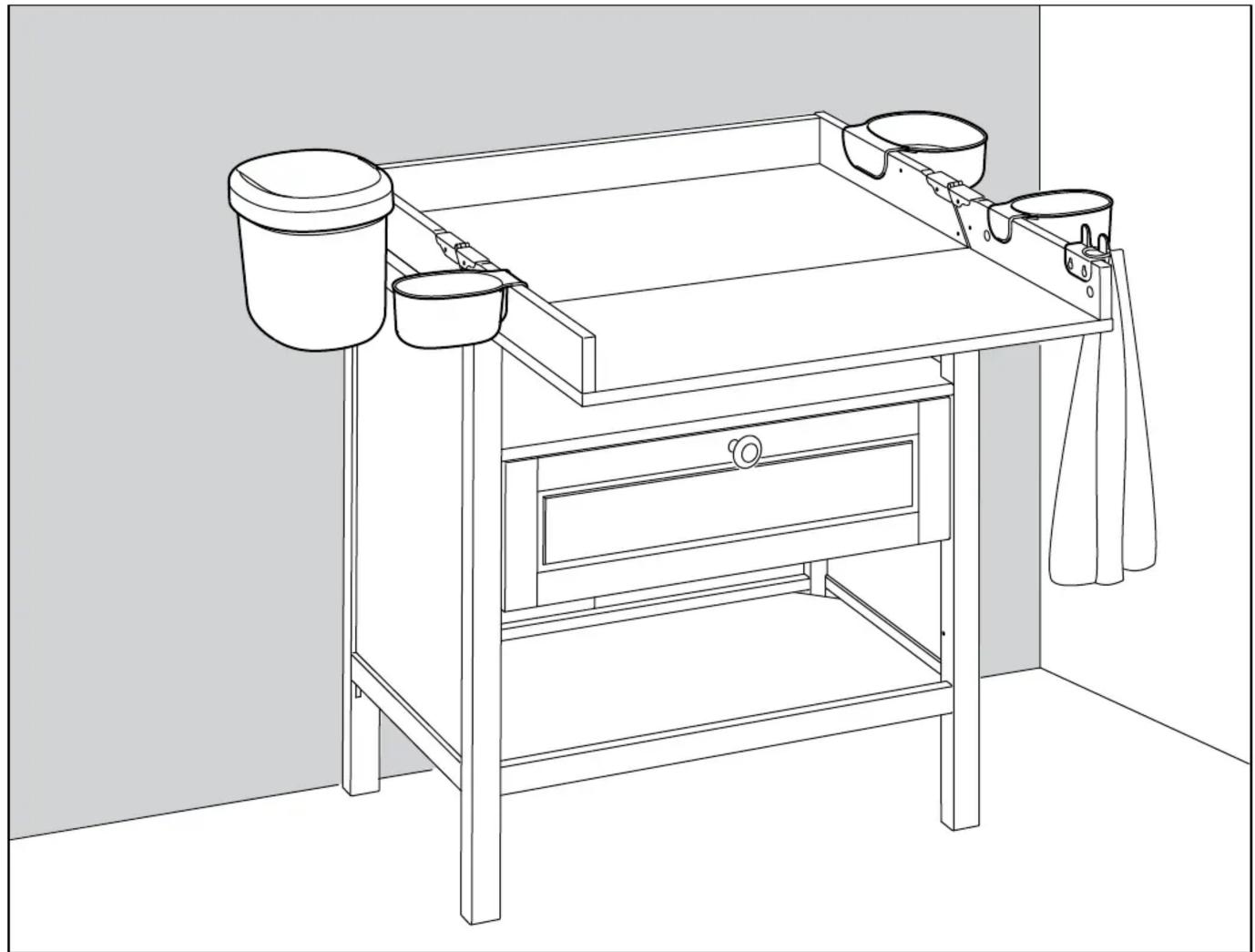 Line drawing of a wooden table with buckets and a drawer, no text or symbols present