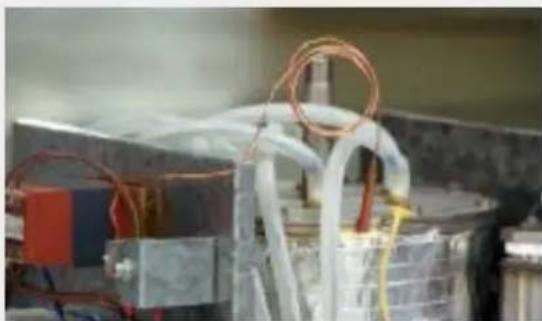 Close-up of electrical equipment with wires and components, no visible text or symbols