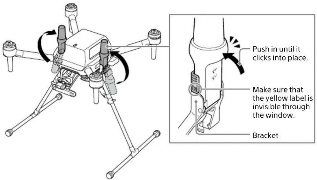 Push in until it clicks into place. Make sure that the yellow label is invisible through the window. Bracket