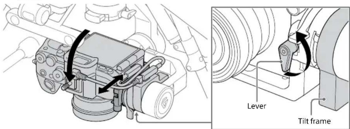 Technical diagram showing mechanical assembly with lever and tilt frame components, including directional arrows indicating motion or movement.