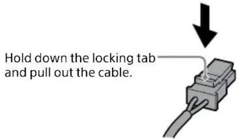 Hold down the locking tab and pull out the cable.