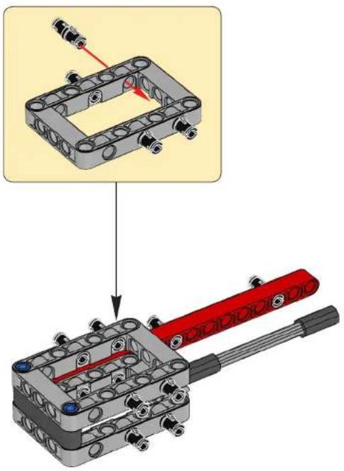 Mechanical assembly diagram showing a bracket with mounting holes and a red-handled tool (no text or symbols present)