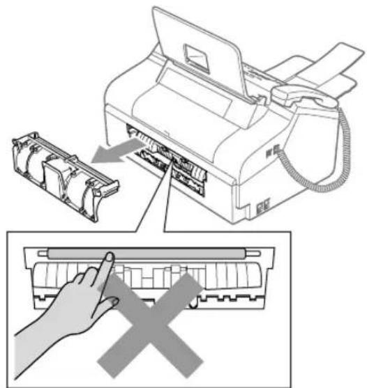 Diagram illustrating printer press operation with hand press and cross symbol indicating disassembly or reassembly