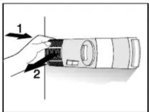 Diagram showing a hand holding a cylindrical device with labeled parts 1 and 2, likely illustrating a mechanical or optical setup.