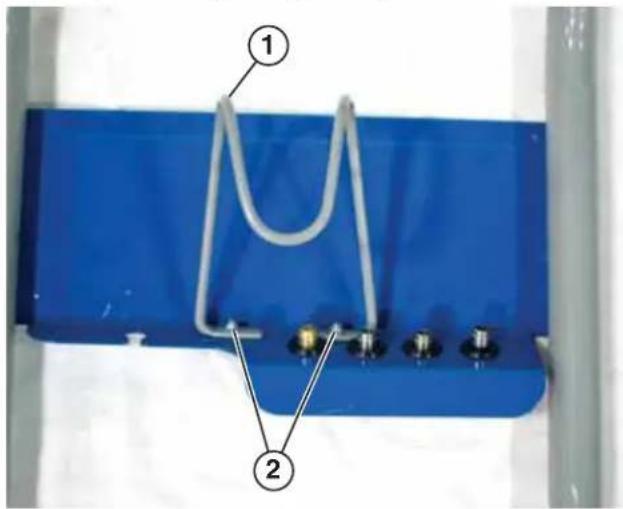 Diagram of a U-shaped cable or wire connection with numbered components labeled 1 and 2, showing connections to four pins.
