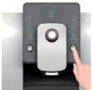 Close-up of a hand pressing a button on a device, with Chinese characters visible on the screen.