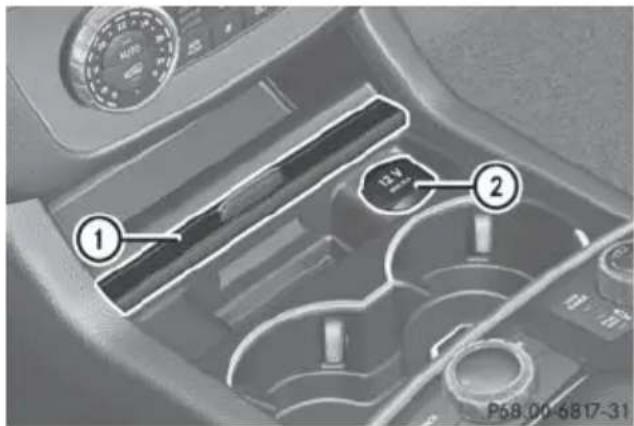 Mercedes-Benz GL (2014) - Socket in the front-compartment center console - 1