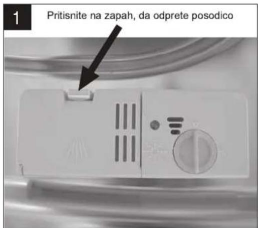1 Pritisnite na zapah, da odprete posodico