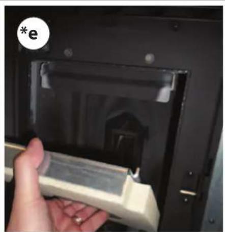 Hand inserting a plastic clip into a black plastic device (no text or symbols visible)