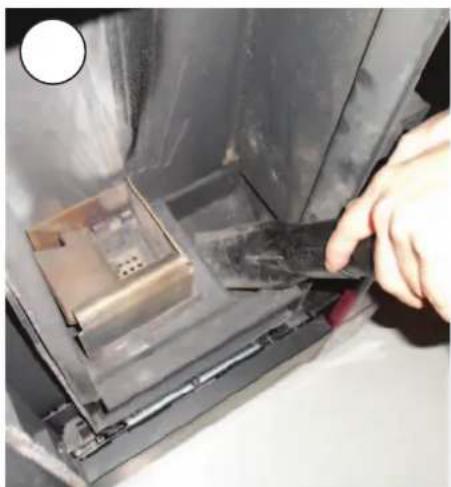 Close-up of a hand inserting a plastic into a device component (no visible text or symbols)