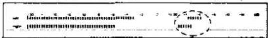 Scanned document fragment showing a ruler and a circular diagram with text, likely from a technical or academic paper.