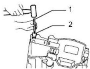 Technical diagram showing a hand operating a tool with labeled parts 1 and 2, likely illustrating a mechanical or electrical assembly.