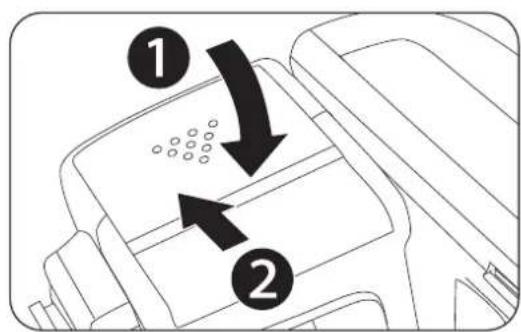 Diagram showing two labeled arrows pointing to a device component with granular texture, likely illustrating a process or assembly.