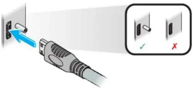 Diagram showing a plug with a blue arrow pointing to a terminal block, alongside a close-up of a device with checkmark and cross symbols.