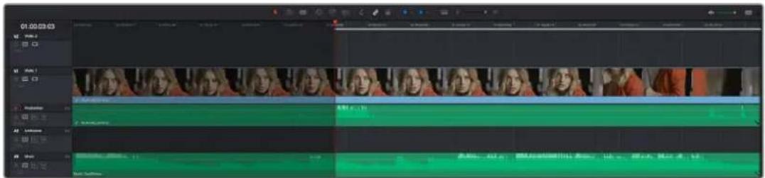 Screenshot of video editing software interface showing timeline with multiple tracks and clips, including a video frame preview and timeline controls.