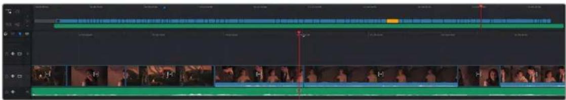 Screenshot of a video editing software timeline interface showing multiple tracks and clips with red annotations indicating key frames or events.