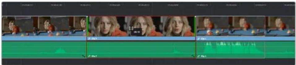 Video editing timeline interface showing multiple tracks with clips and timecode, likely from a video editing program or broadcast.