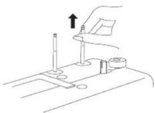 Line drawing of a mechanical assembly with a hand holding a tool and a bracket, no text or symbols present