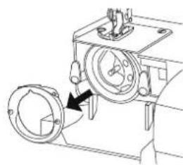 Technical line drawing of a mechanical device with a circular component and a pointer indicating direction (no text or symbols)