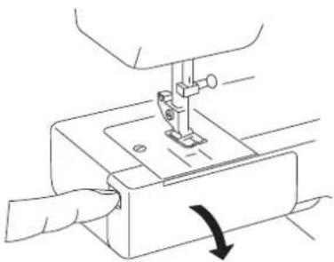 Line drawing of a sewing machine needle stitching fabric, with a hand operating the base (no text or symbols)