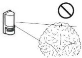 Diagram showing a spray gun emitting particles with a prohibition symbol, likely illustrating a chemical or environmental hazard.