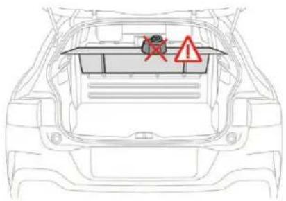Diagram of a car trunk with a warning sign indicating no hazard, and a red 'X' symbol highlighting a specific area.