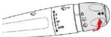 Diagram of a car air condition control panel with directional indicators and a red arrow indicating rotation or change.