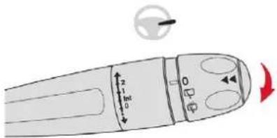 Diagram of a device with labeled parts and directional arrows, including a dial indicator and arrow symbol.
