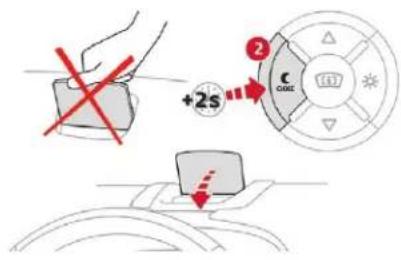 Diagram illustrating a device operation with a hand holding a device and a control panel showing +2s and C mode settings.